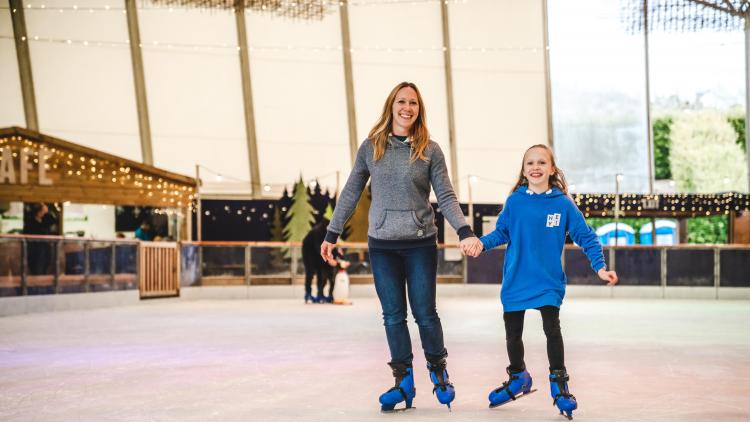 Mum and daughter ice skating