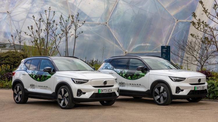 Electric Volvo cars parked in front of the Eden Project Biomes